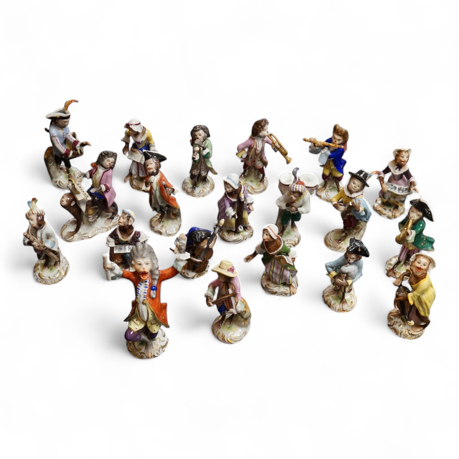 A group of twenty German porcelain monkey band figures, largest 15.5cm high